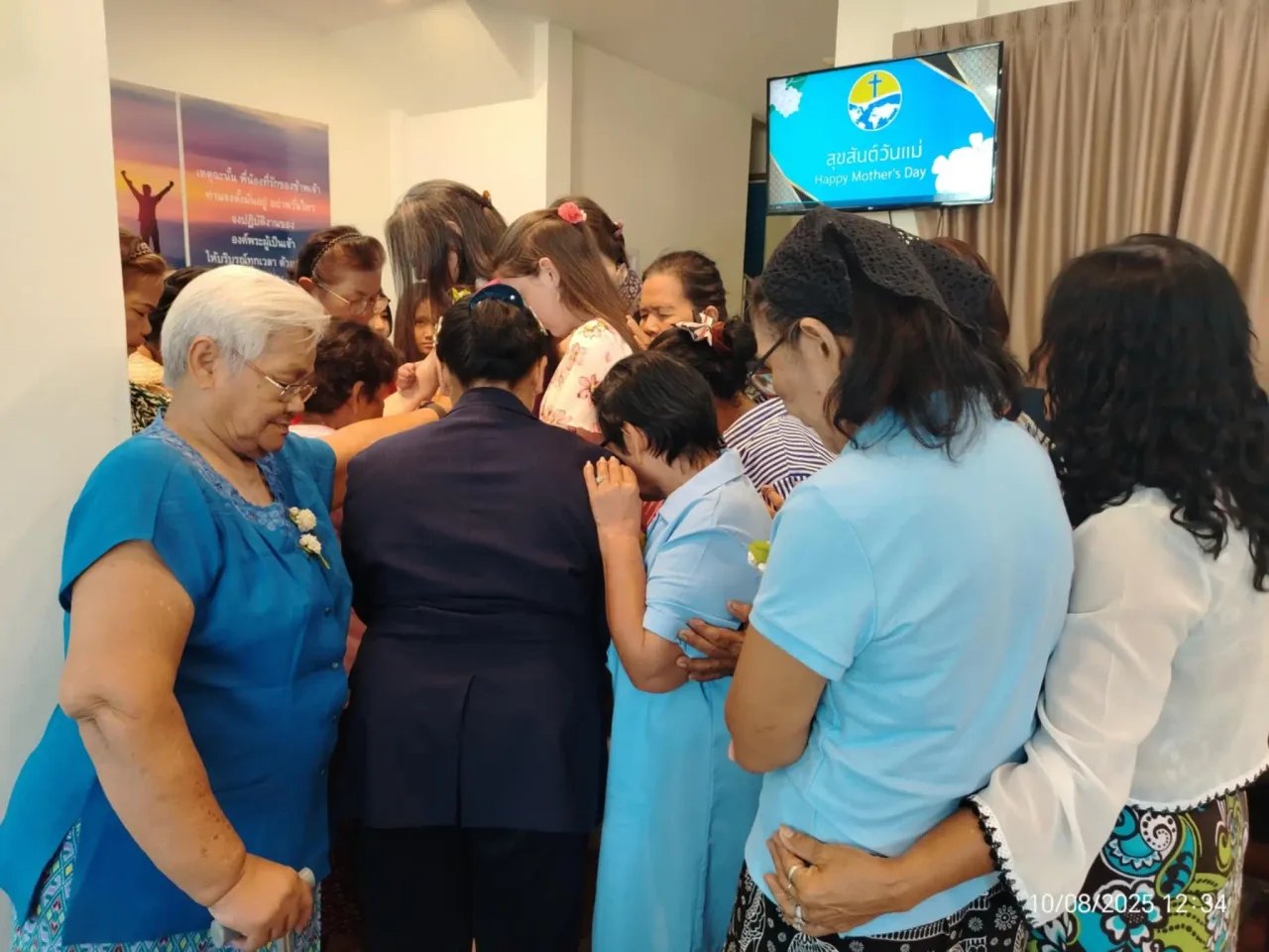 Praying and laying hands on one another